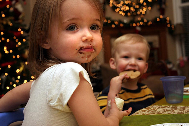 Cute kids eating chocolate